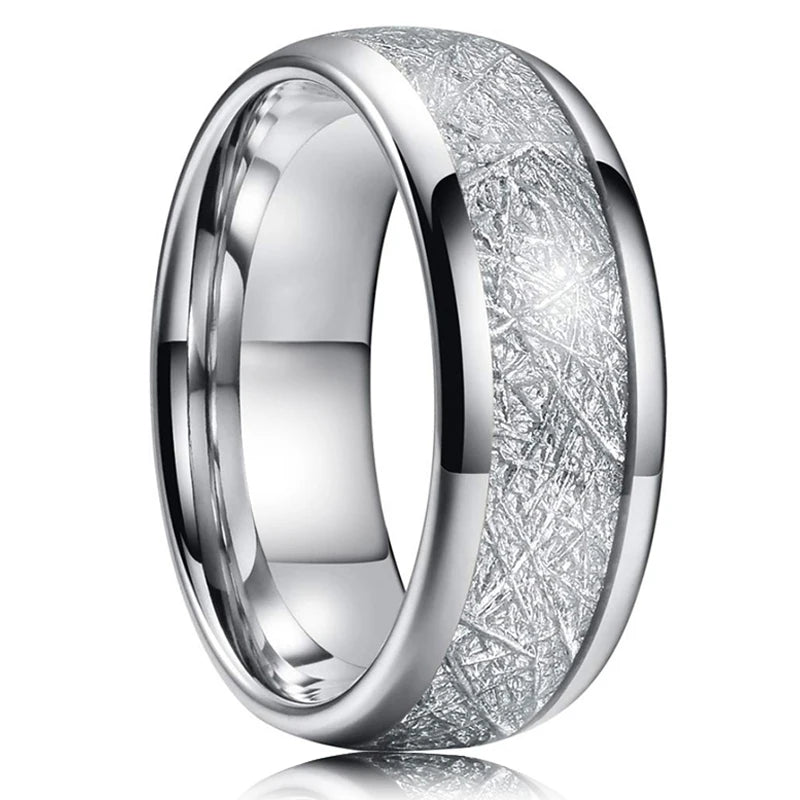 Silver ring with textured design on a white background