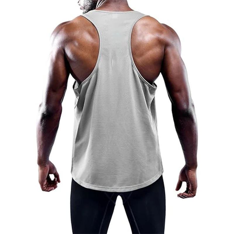 Person wearing a gray tank top on a white background