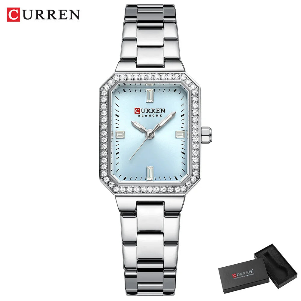 Silver Curren watch with a light blue face on a white background