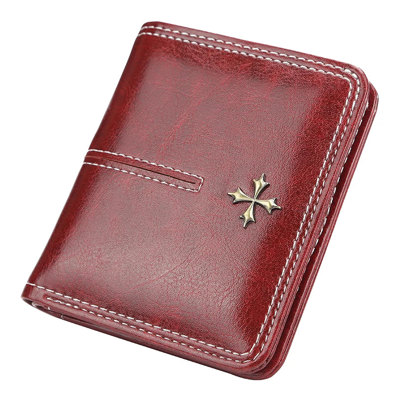 Red leather wallet with a gold cross emblem on a white background