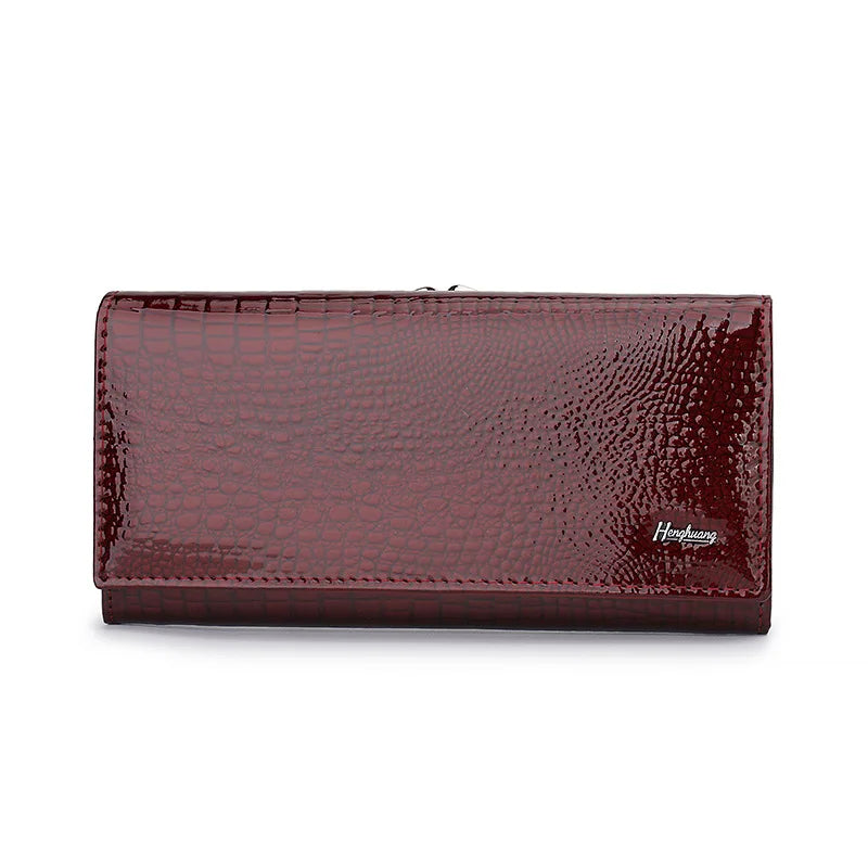 Maroon wallet with crocodile texture on a white background