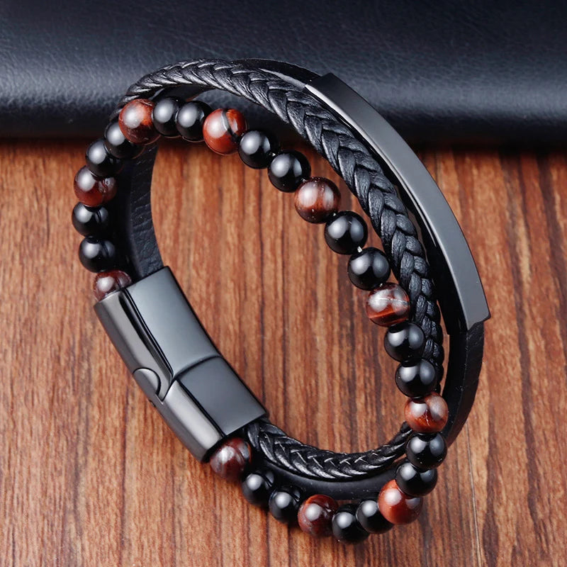 Bracelet with black and red beads on a wooden surface