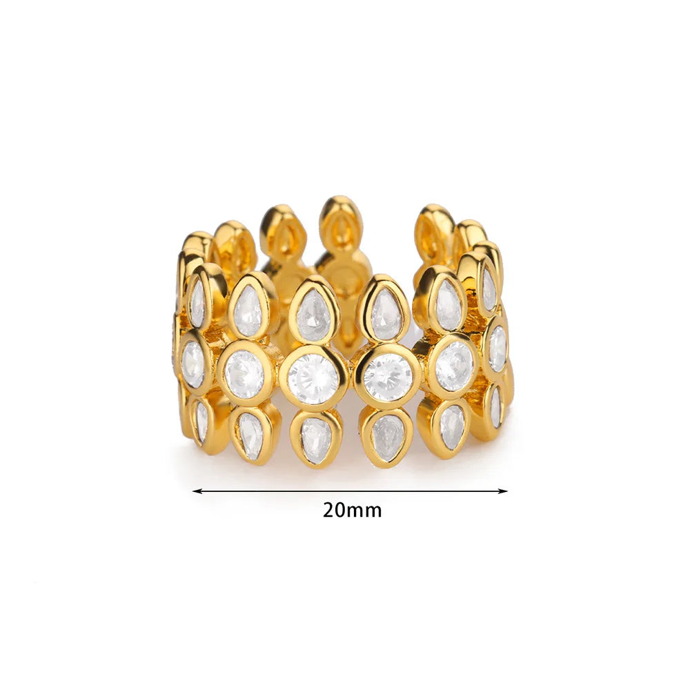 Gold ring with clear stones on a white background