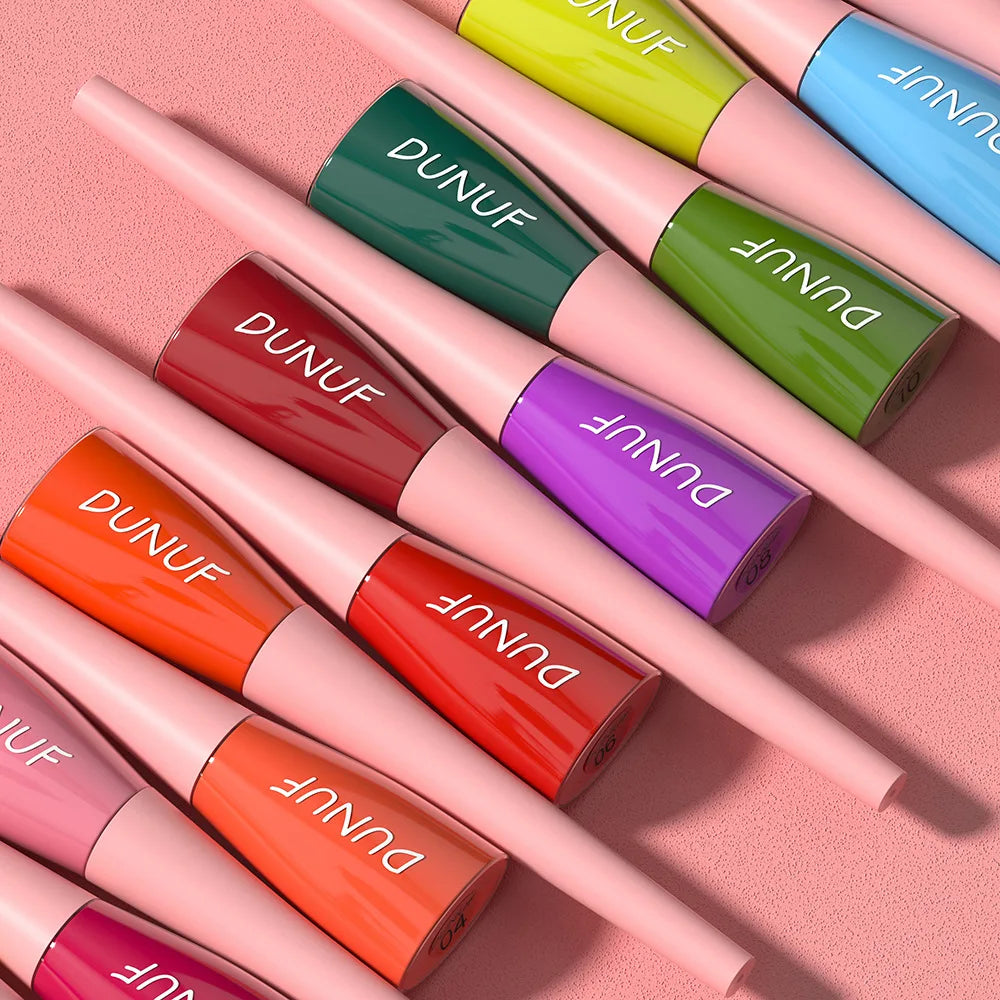 Collection of DUNUF lip glosses in various colors on a pink background