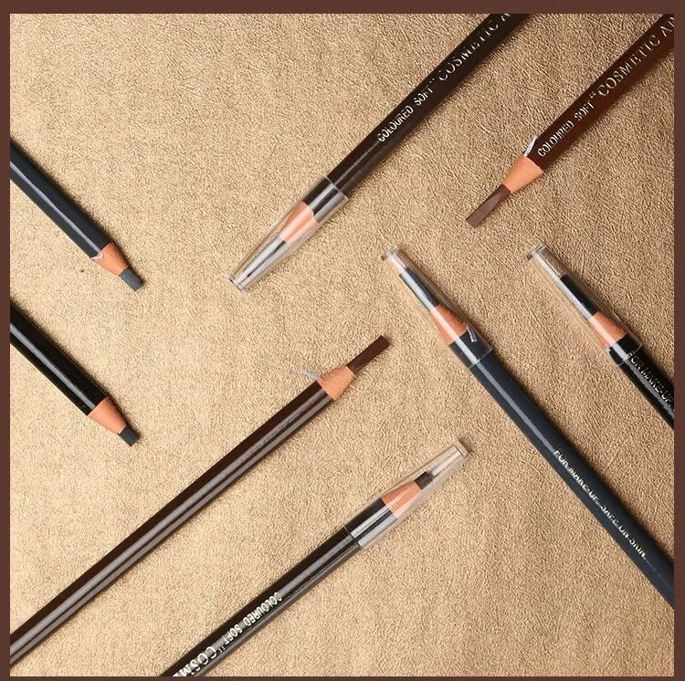 Makeup pencils on a textured beige surface