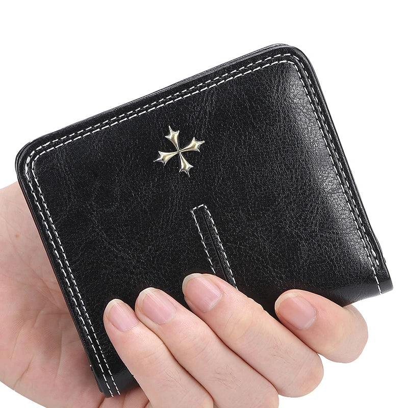 Black leather wallet with a star emblem held by a hand on a white background