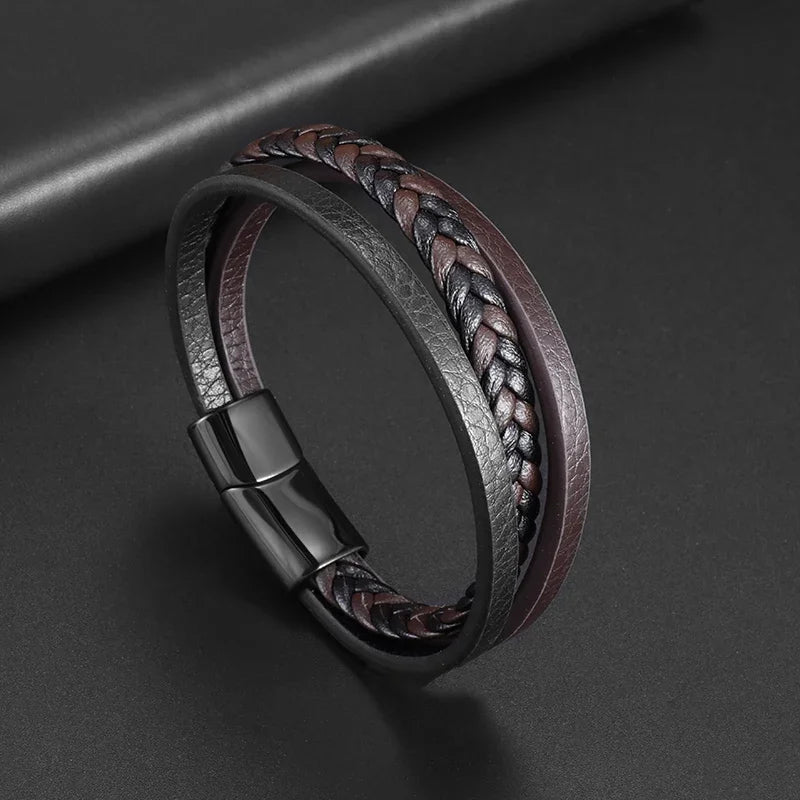 Braided leather bracelet with a magnetic clasp on a dark background