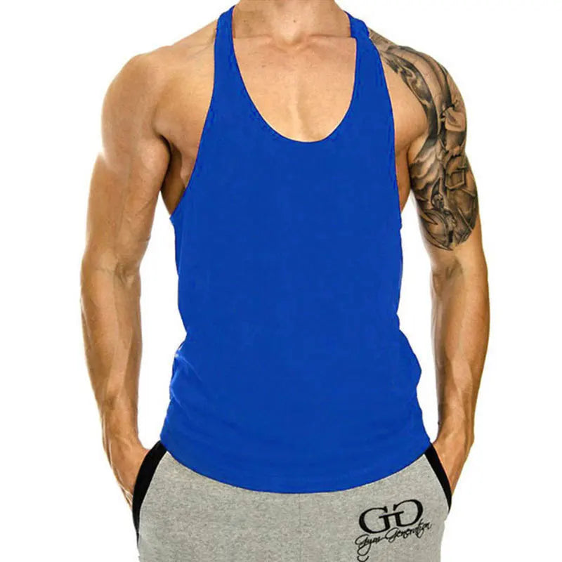 Person wearing a blue tank top and gray shorts with a visible brand logo on a white background