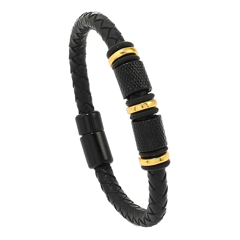 Black braided bracelet with gold accents on a white background