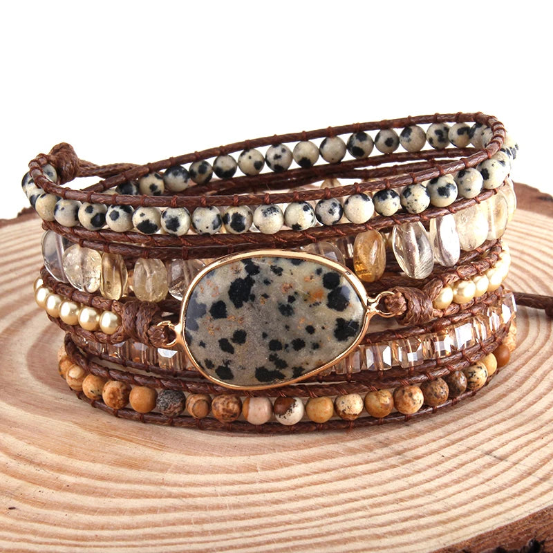 Multistrand beaded bracelet with a stone focal point on a wooden surface