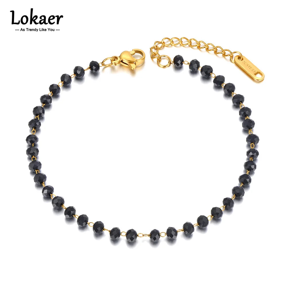Black beaded bracelet with gold chain and clasp on a white background, featuring the brand 'Lokaer'.