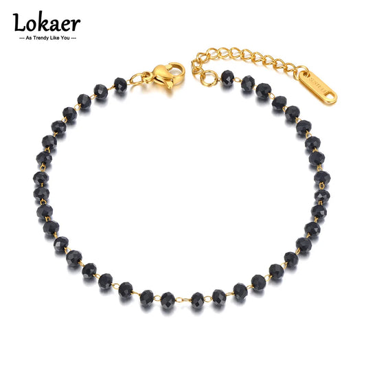Black beaded bracelet with gold chain and clasp on a white background, featuring the brand 'Lokaer'.
