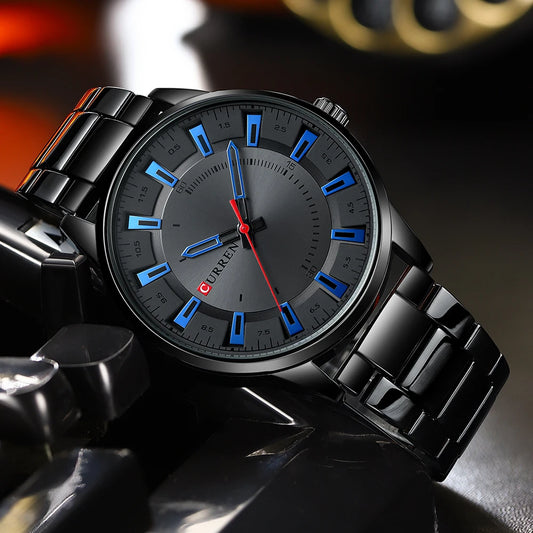 Black wristwatch with blue and red accents on a dark background