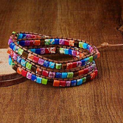 Colorful beaded bracelet on a wooden surface
