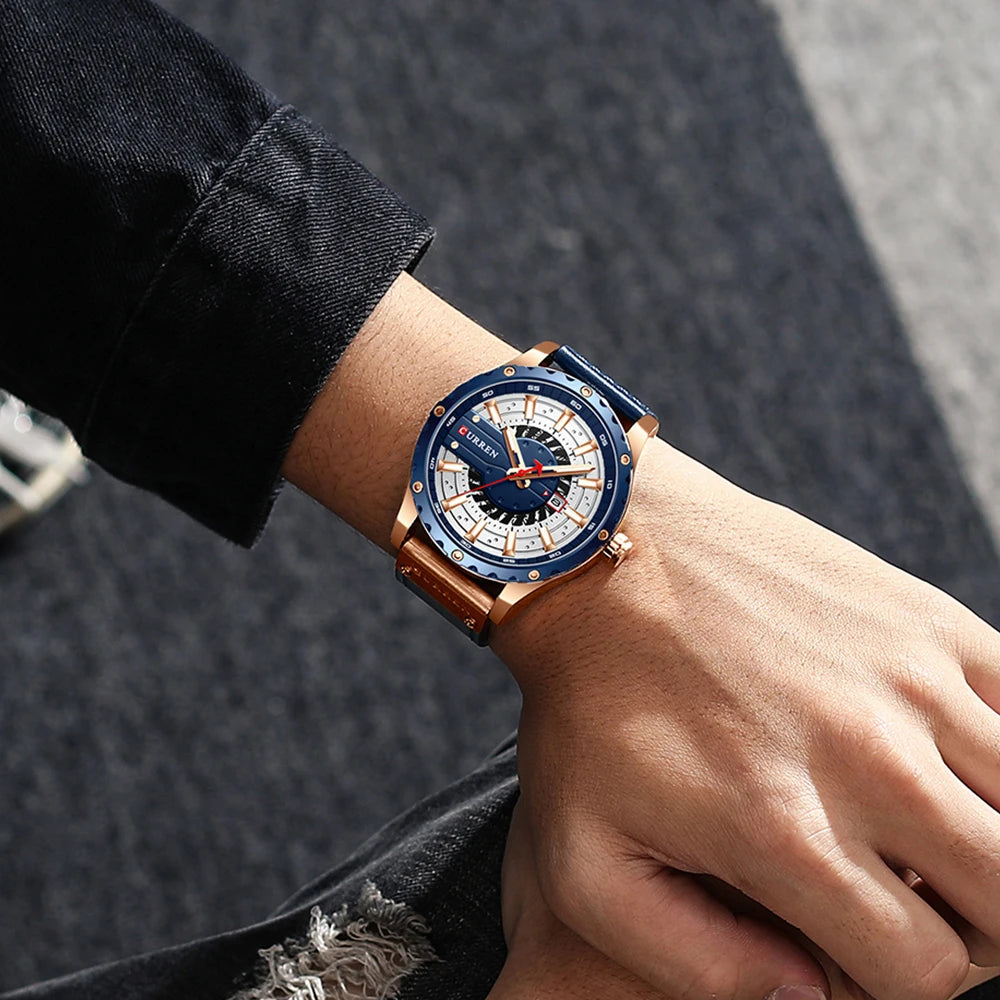 Luxury watch with blue and rose gold design on a wrist against a dark background