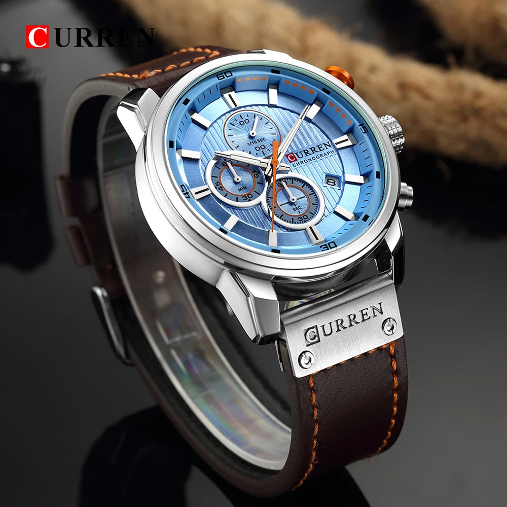Wristwatch with blue dial and brown leather strap, brand 'Curren' visible