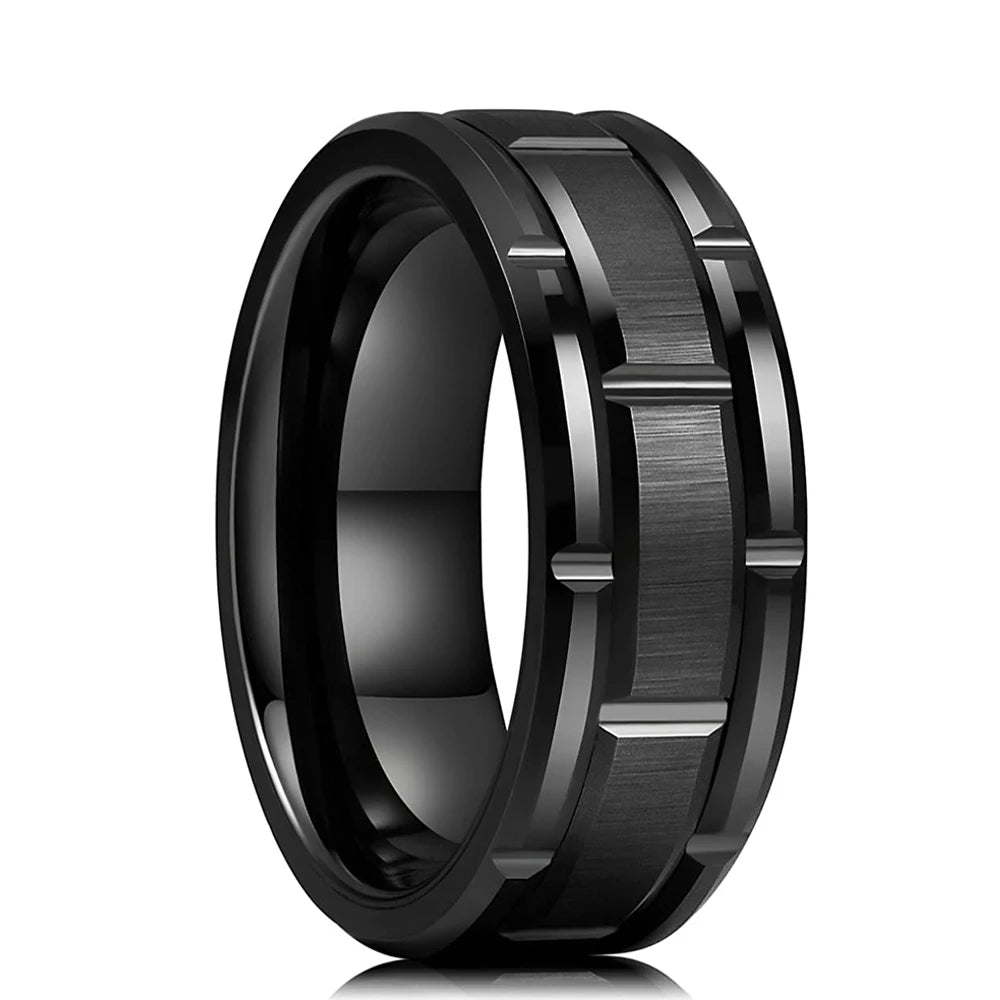 Black tungsten ring with brushed texture on a white background
