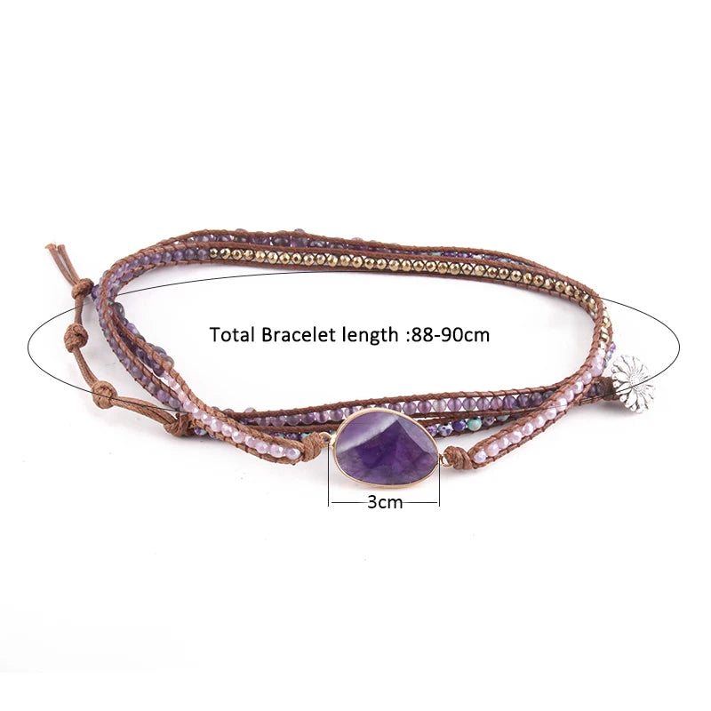 Multistrand bracelet with a purple gemstone bead on a white background