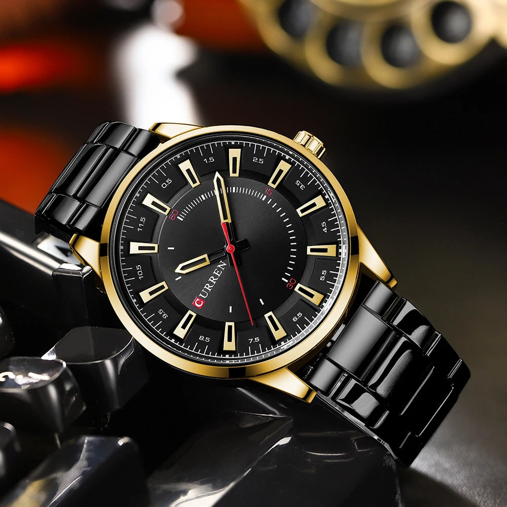 Black and gold watch on a motorcycle with a blurred background