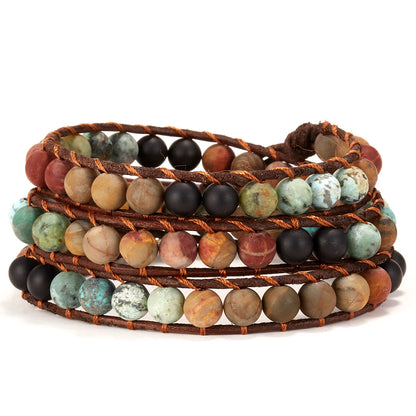 Multistrand bracelet with natural stone beads on a white background