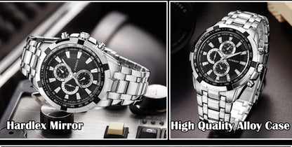 Silver watch with black face on a reflective surface, labeled 'Hardlex Mirror' and 'High Quality Alloy Case'.