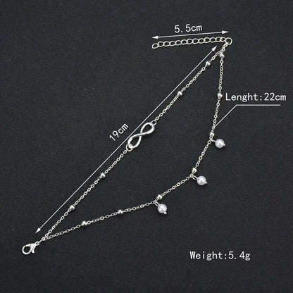 Silver bracelet with measurements on a black background