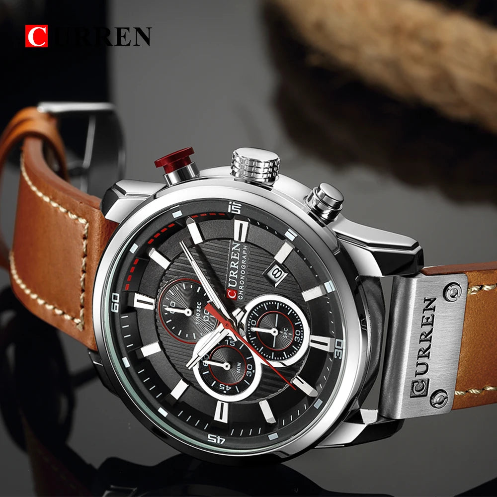 Curren watch with brown leather strap and silver case on a dark background