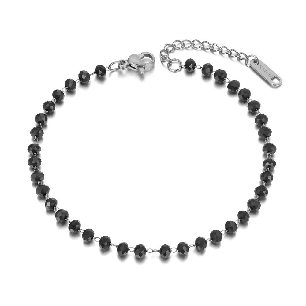 Black beaded bracelet with silver clasp on a white background