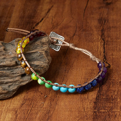 Multicolored beaded bracelet on a wooden surface