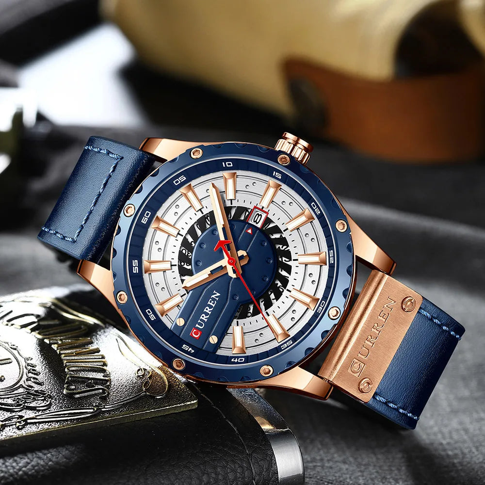 Luxury watch with blue strap and rose gold accents on a textured surface