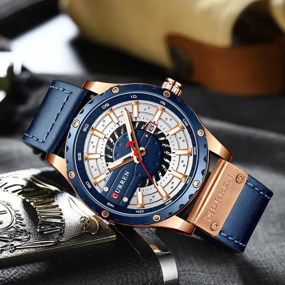 Luxury watch with blue strap and rose gold accents on a textured surface