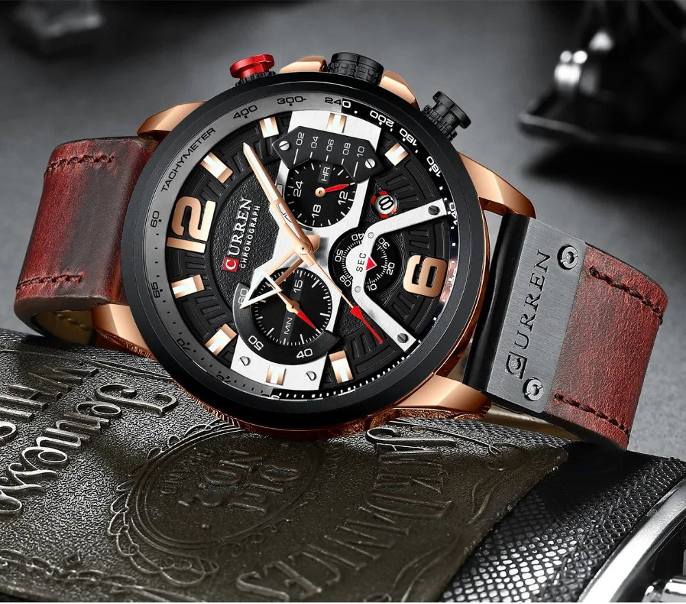Curren watch with brown leather strap on a textured surface