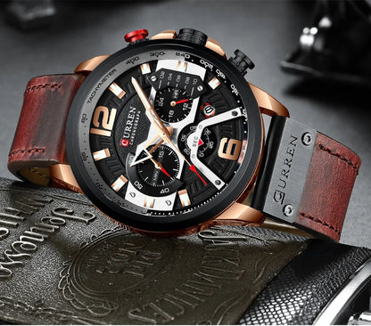 Curren watch with brown leather strap on a textured surface
