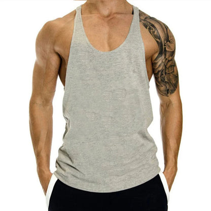 Person wearing a gray tank top with a white background