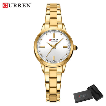 Gold wristwatch with white face and 'Curren' branding on a white background