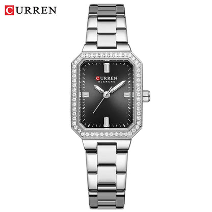 Silver Curren watch with black face on a white background