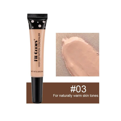Concealer tube with applicator and swatch on a white background
