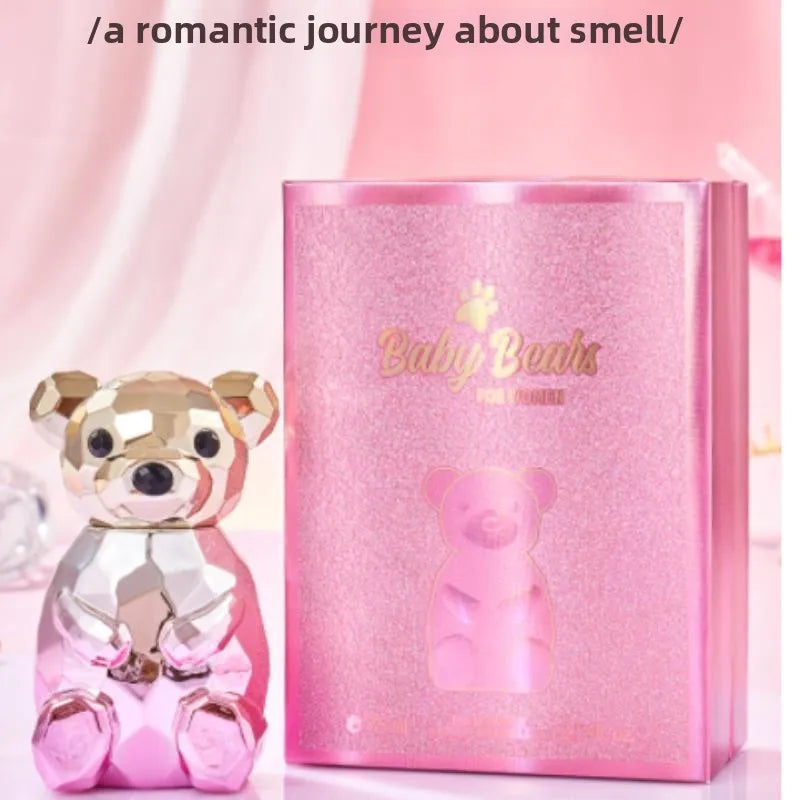 Pink teddy bear-shaped bottle and packaging with 'Baby Bodhi' branding on a pink background.