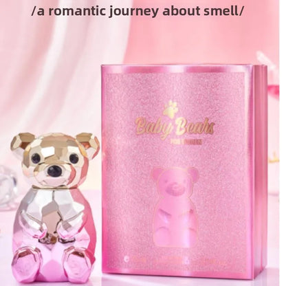 Pink teddy bear-shaped bottle and packaging with 'Baby Bodhi' branding on a pink background.