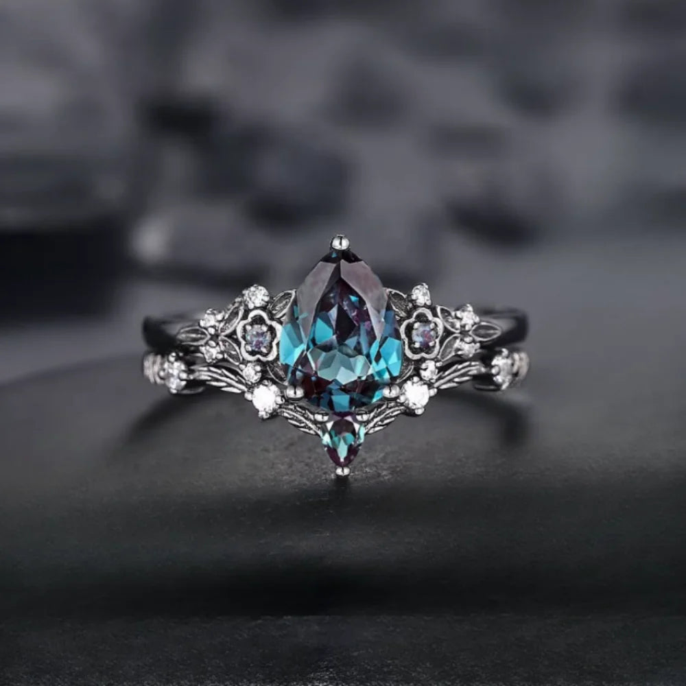 Elegant ring with a central gemstone on a dark background