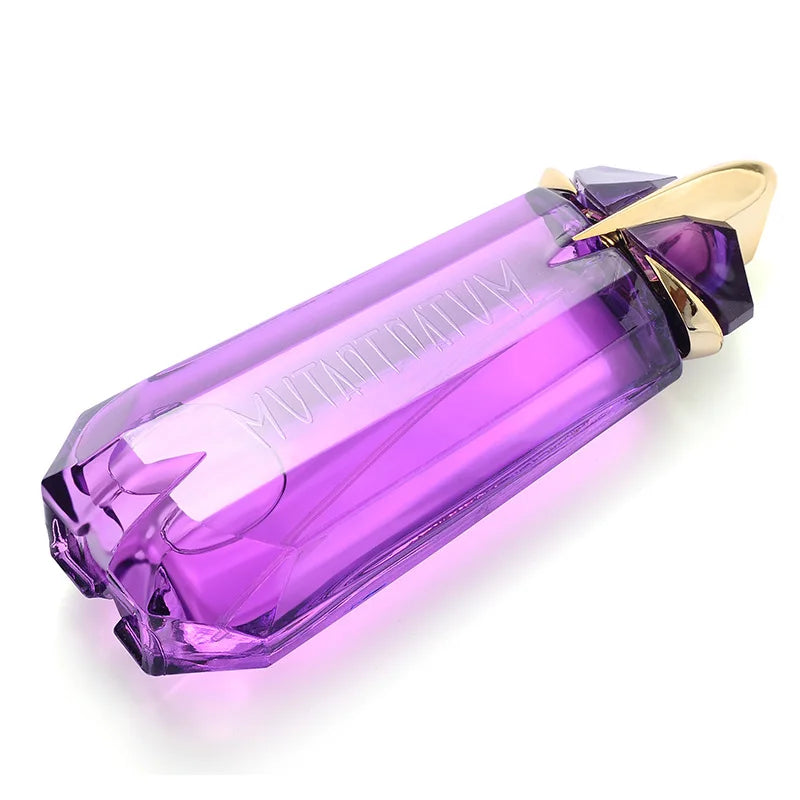 Purple perfume bottle with gold cap on a white background