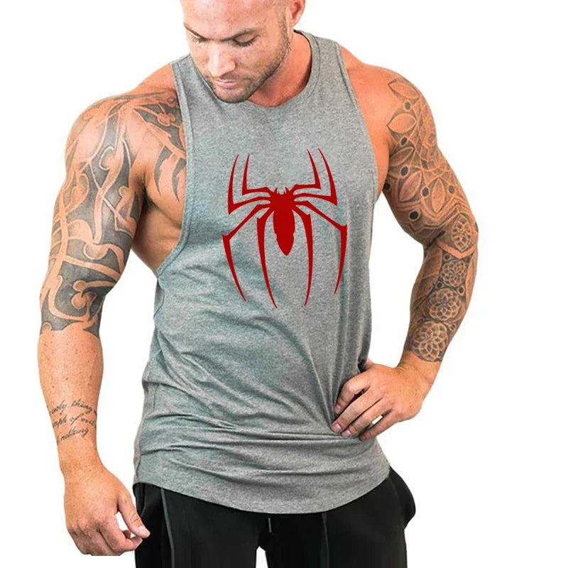 Man wearing a gray tank top with a red spider logo on a white background