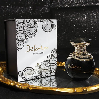 Belac for women perfume bottle and packaging on a decorative tray with a dark background