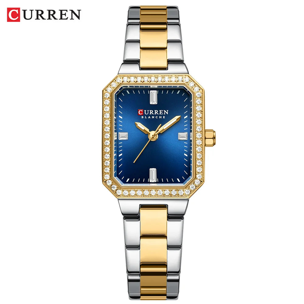 Curren watch with gold and silver band on a white background
