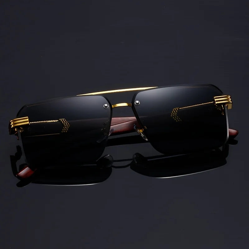 Black sunglasses with gold accents on a dark background
