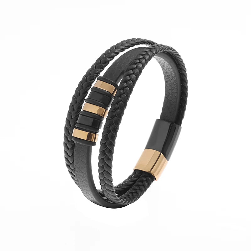 Black braided leather bracelet with gold accents on a white background