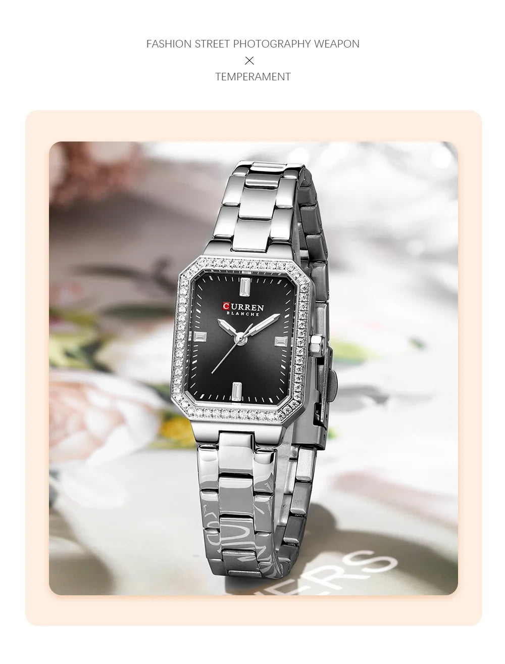 Silver wristwatch with black dial on a light background