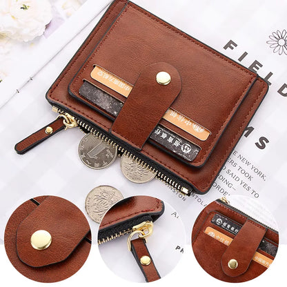 Brown leather wallet with coin pouches on a white background