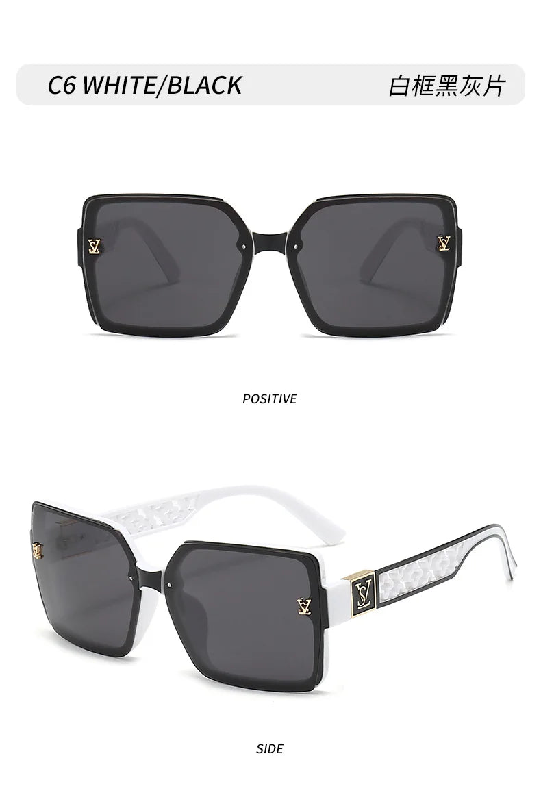 Black sunglasses with gold accents on a white background
