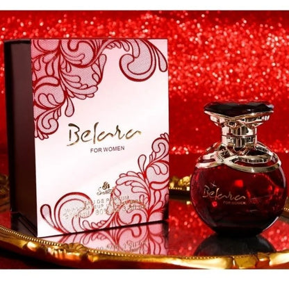 Belara perfume bottle and packaging on a red glittery background